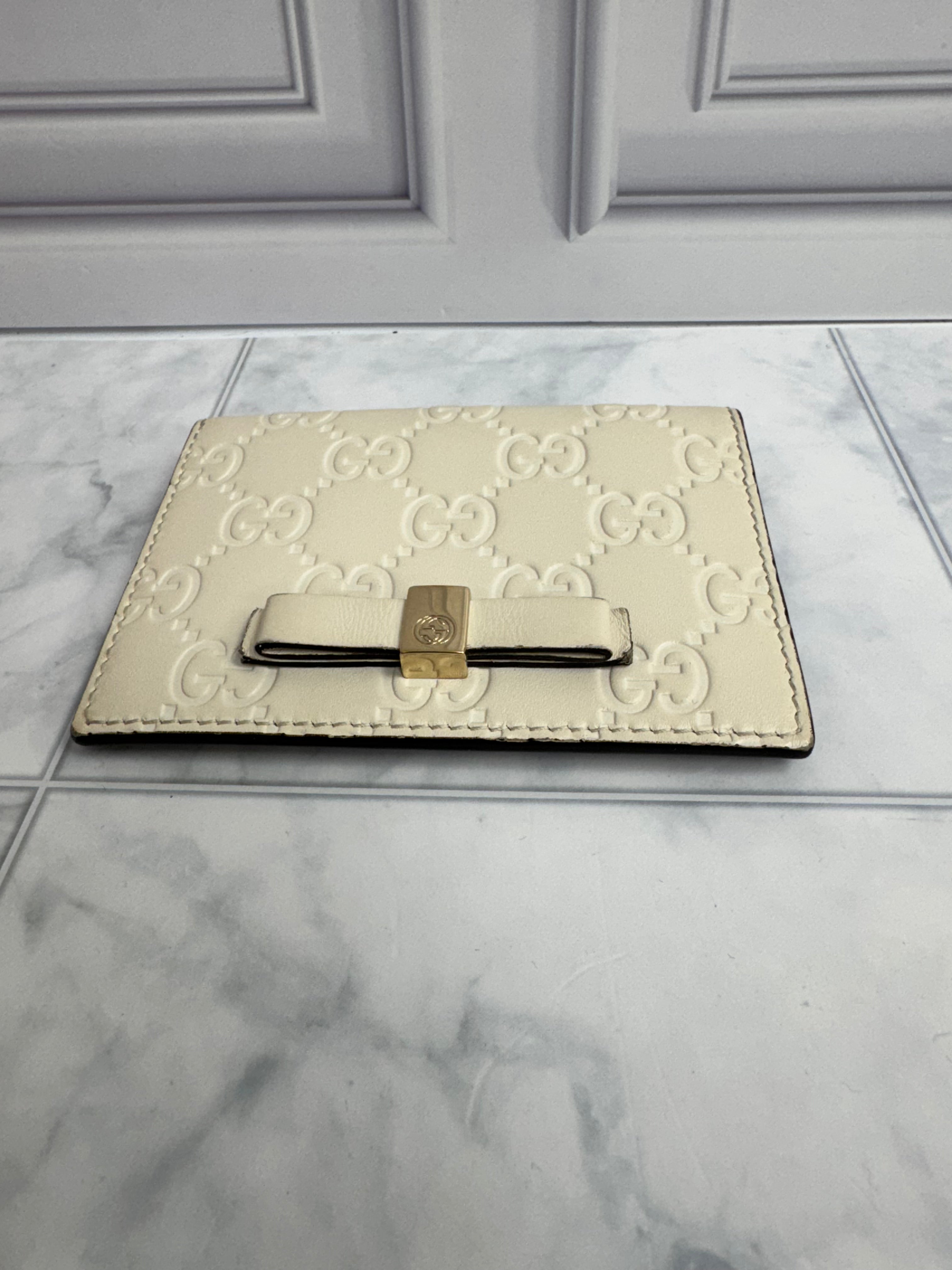 Gucci Beige Guccissima Embossed Leather Compact Wallet