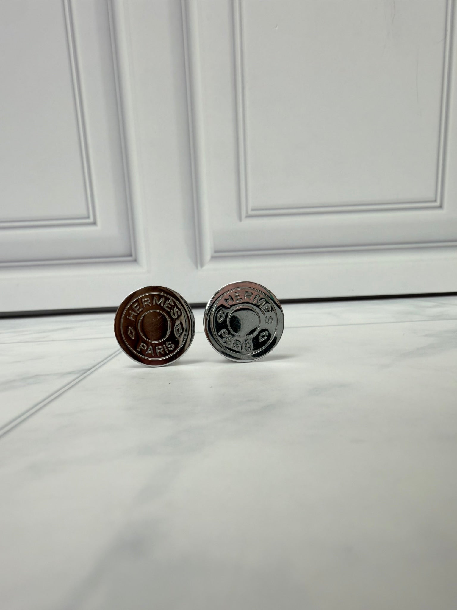 Hermes Silver Tone Coin Clip On Earrings