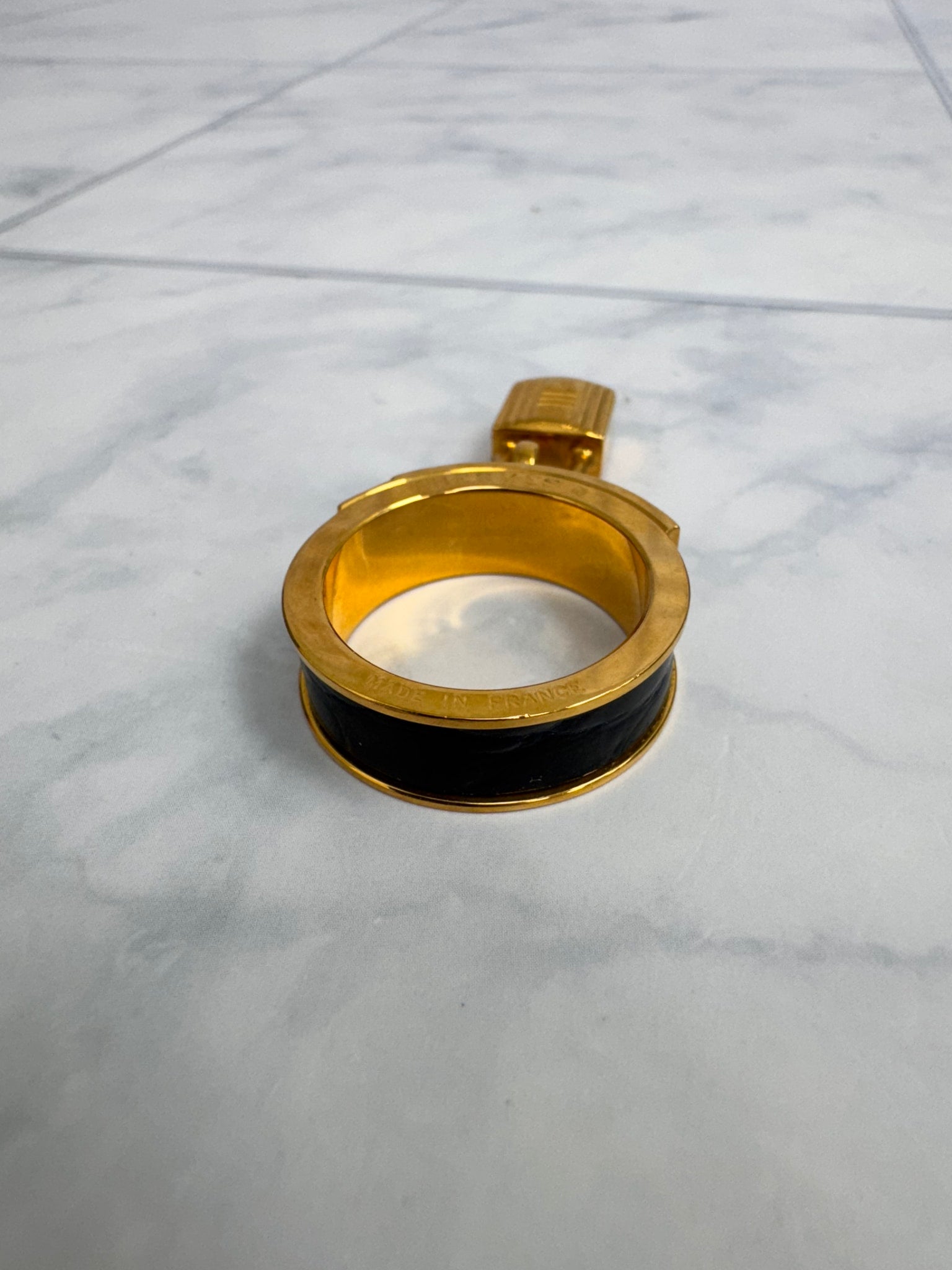 Hermes Gold Tone And Black Kelly Lock Scarf Ring