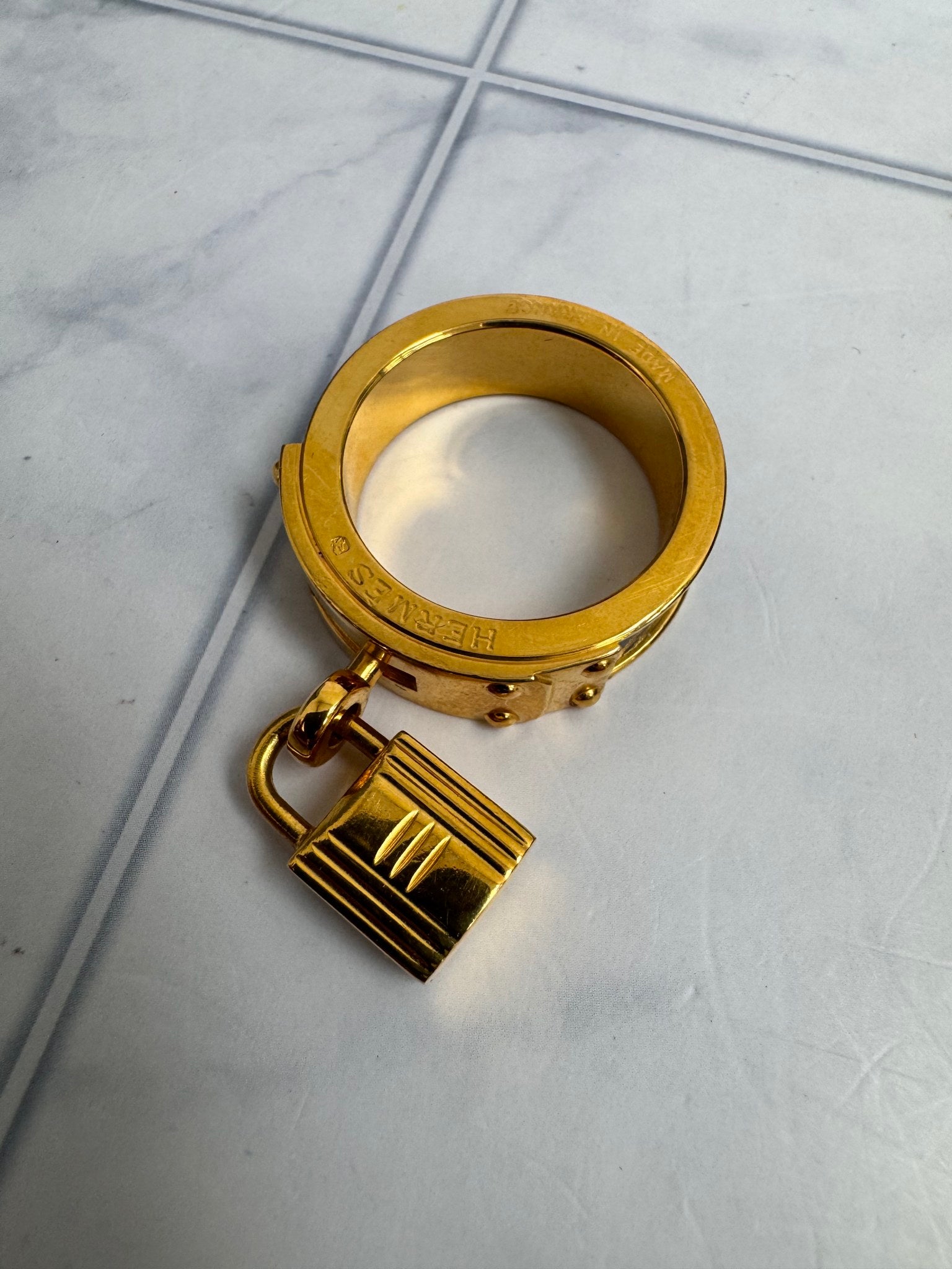 Hermes Gold Tone And Black Kelly Lock Scarf Ring