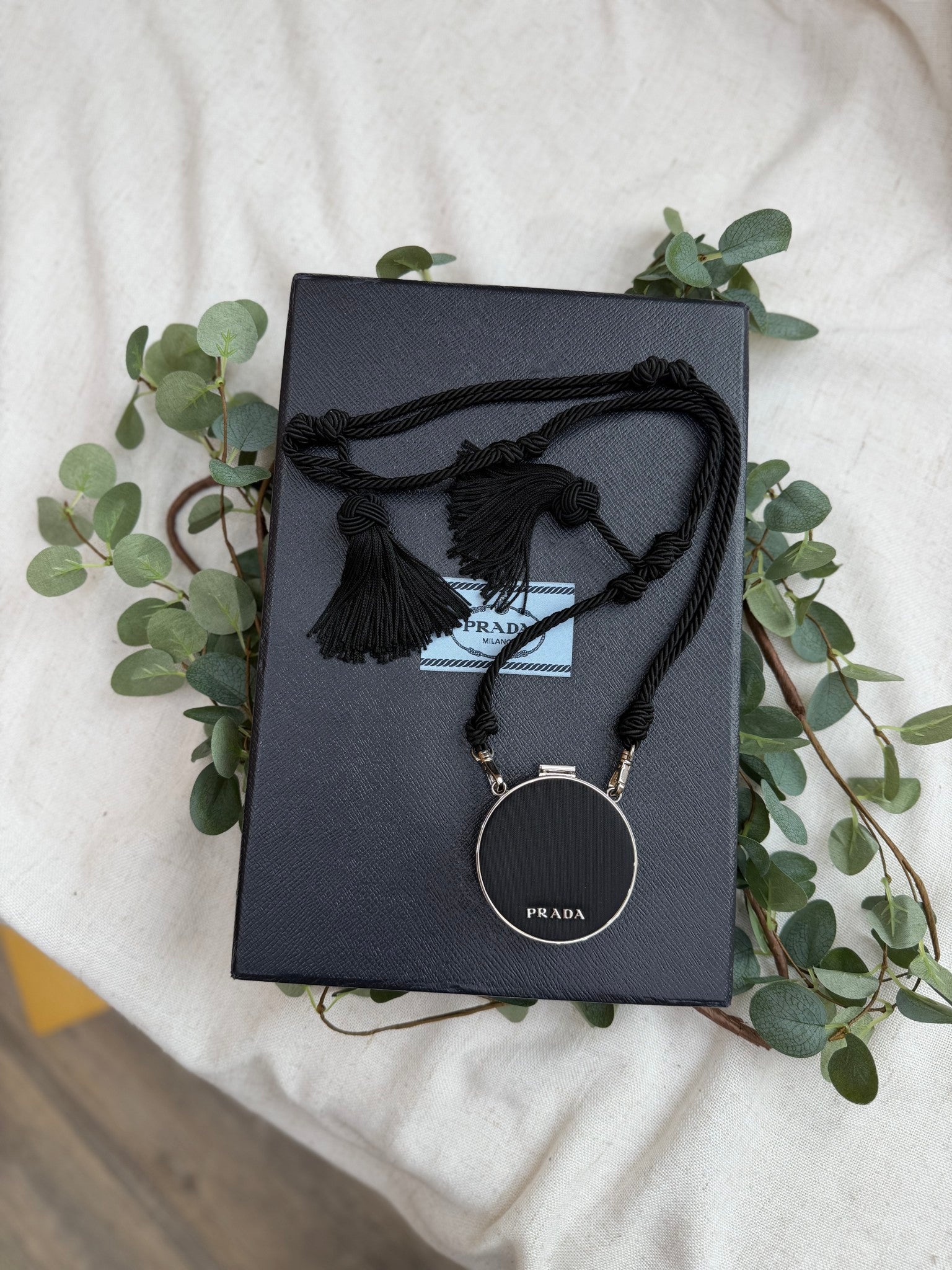 Prada Black Saffiano Leather Round Mirror Tassel Necklace
