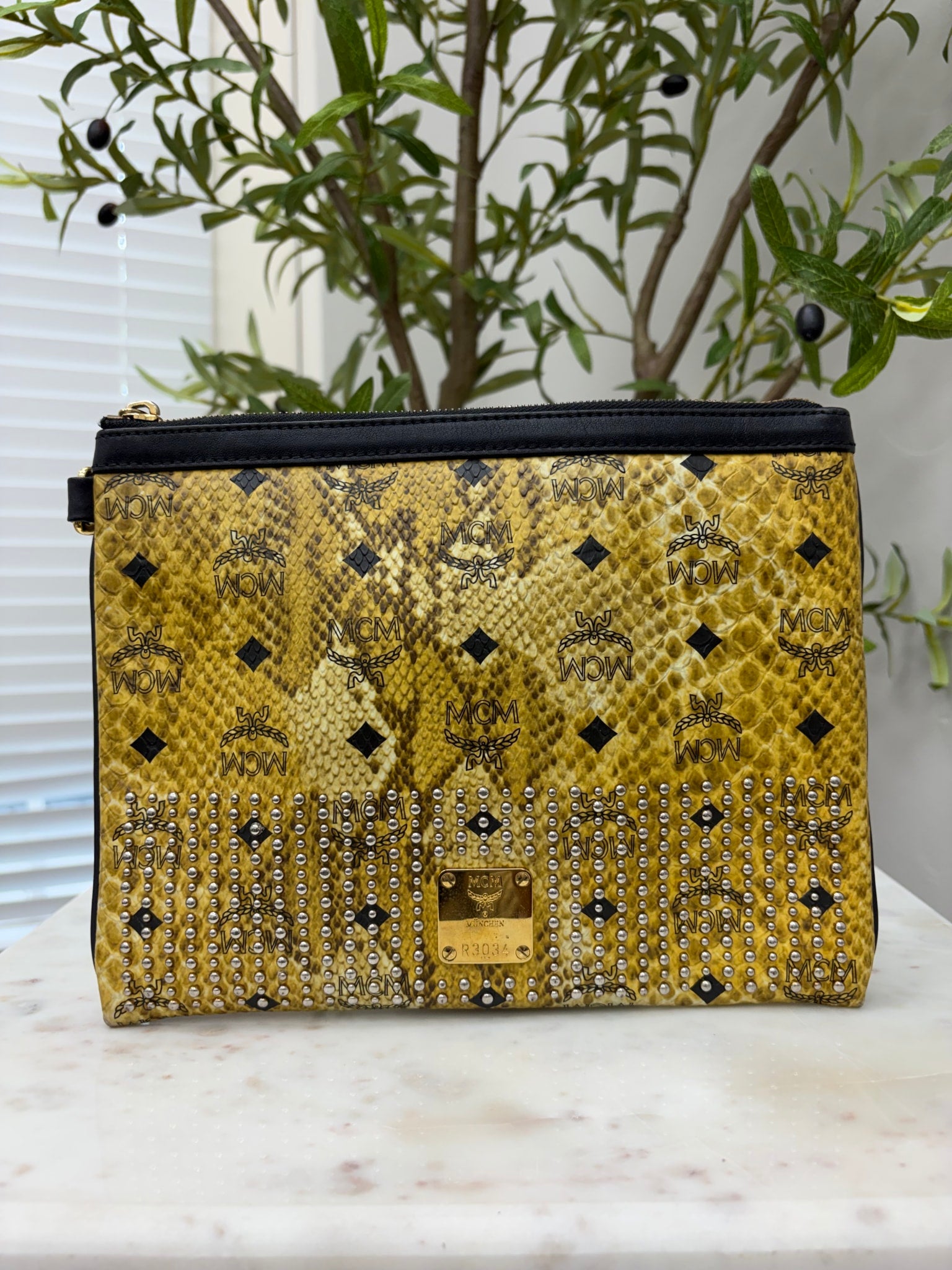 MCM Yellow Python Embossed Clutch