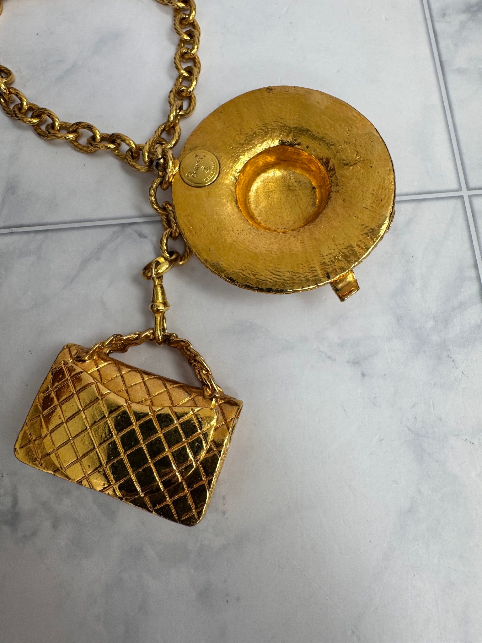 Chanel Gold Tone Sun Hat And Quilted Handbag Necklace