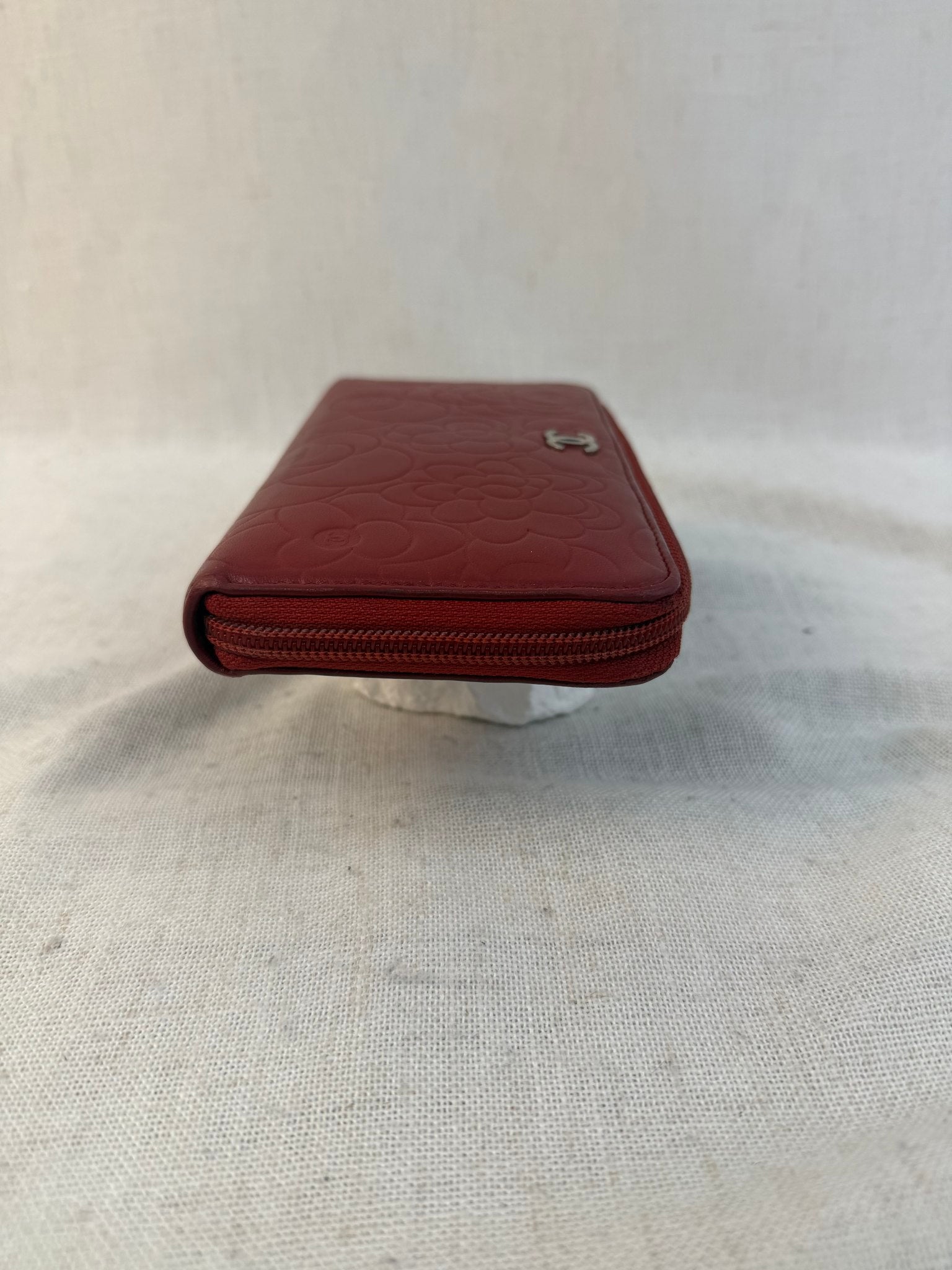 Chanel Red Lambskin Camellia Embossed Zippy Wallet