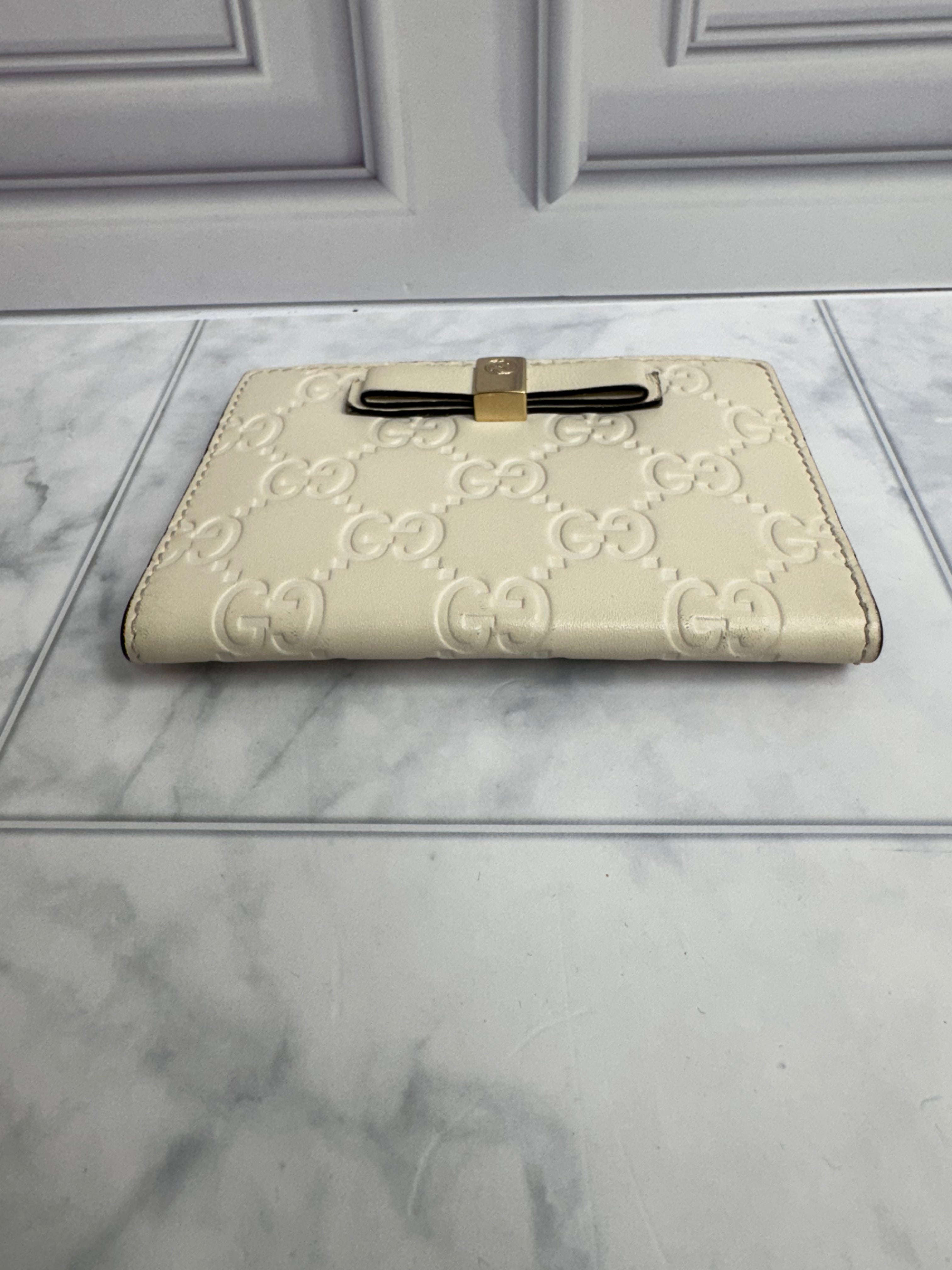 Gucci Beige Guccissima Embossed Leather Compact Wallet