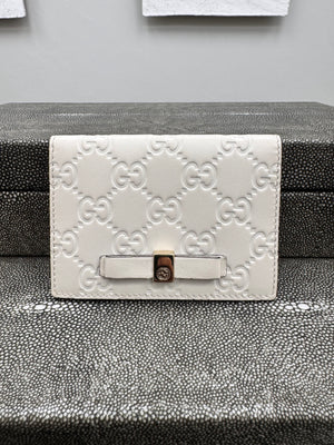 Gucci Beige Guccissima Embossed Leather Compact Wallet