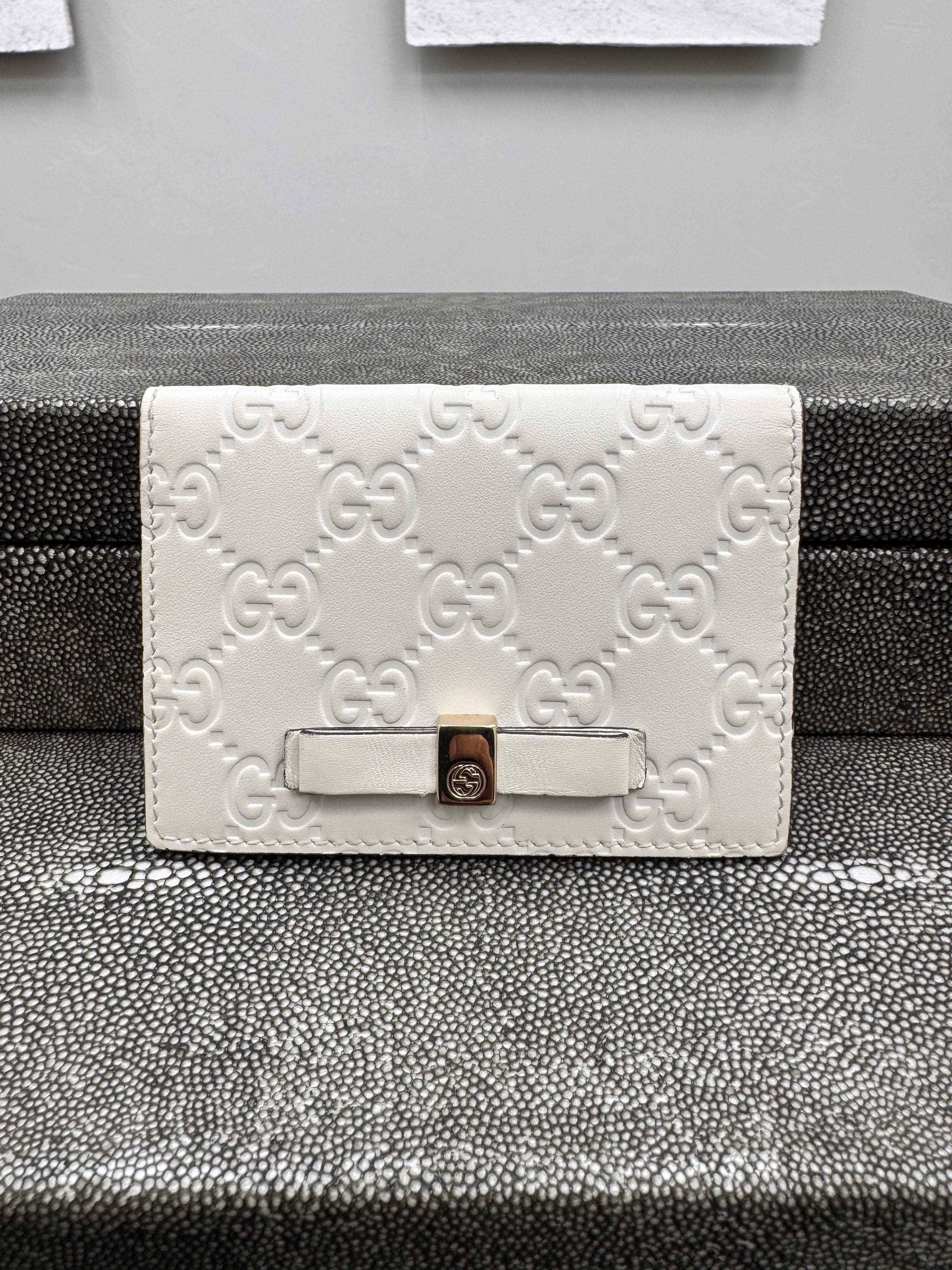 Gucci Beige Guccissima Embossed Leather Compact Wallet