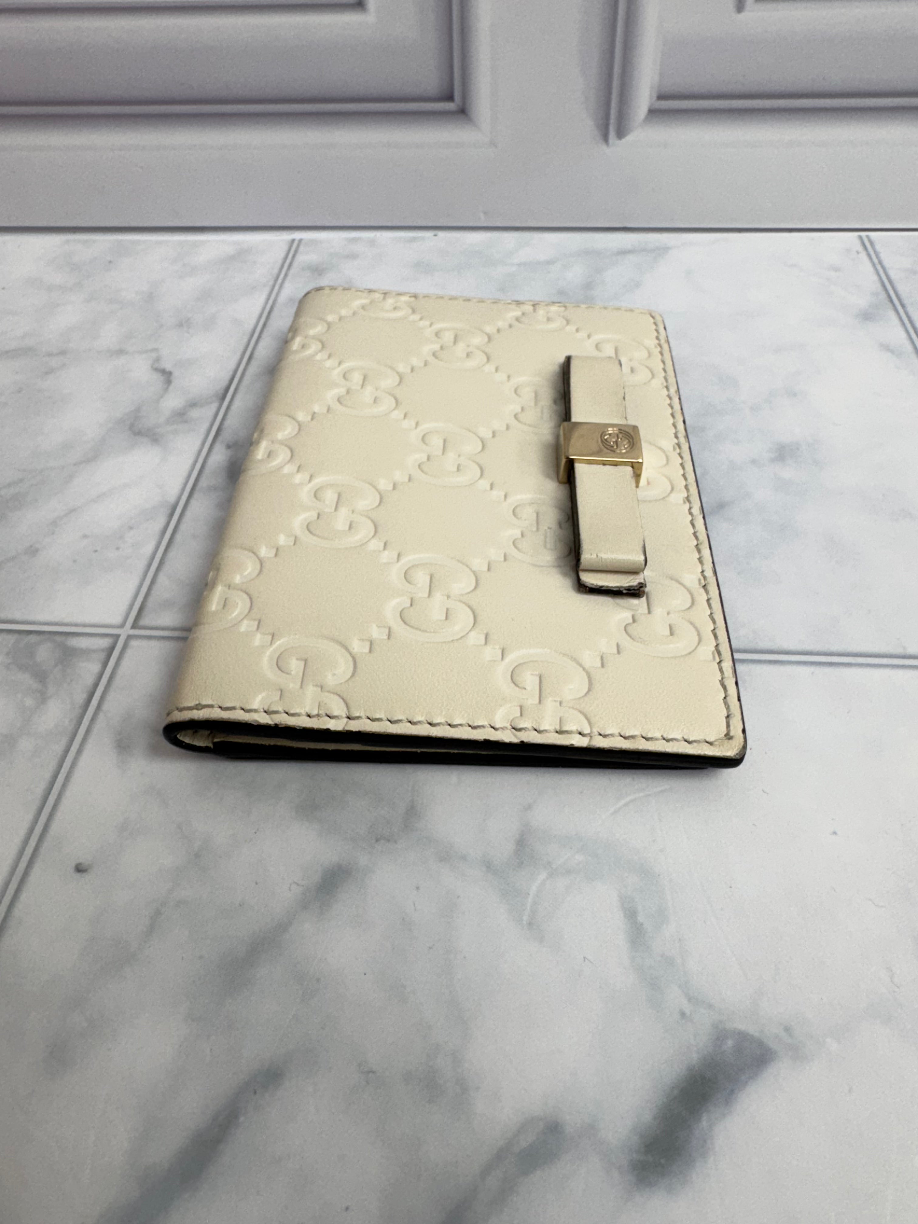 Gucci Beige Guccissima Embossed Leather Compact Wallet