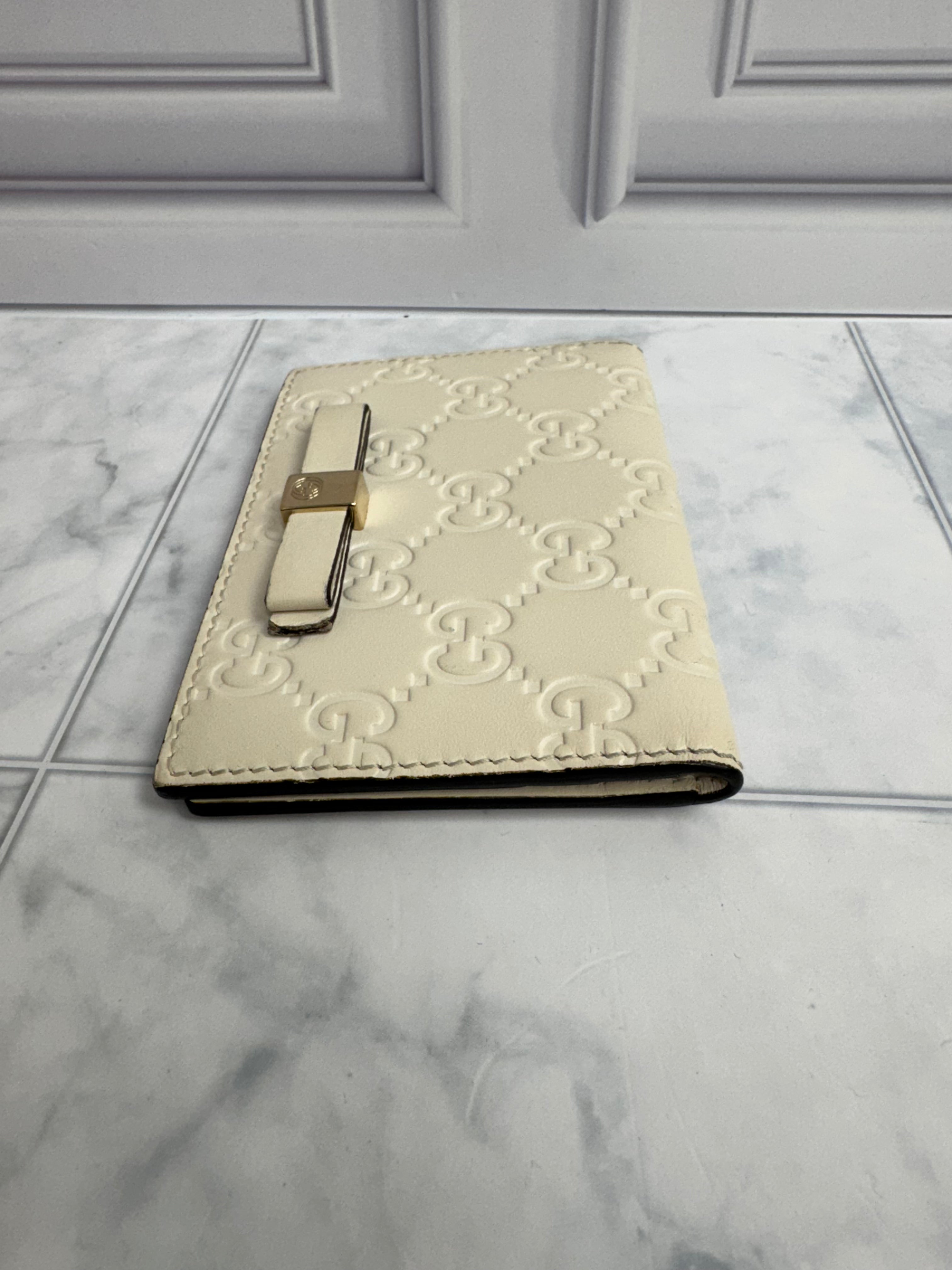 Gucci Beige Guccissima Embossed Leather Compact Wallet