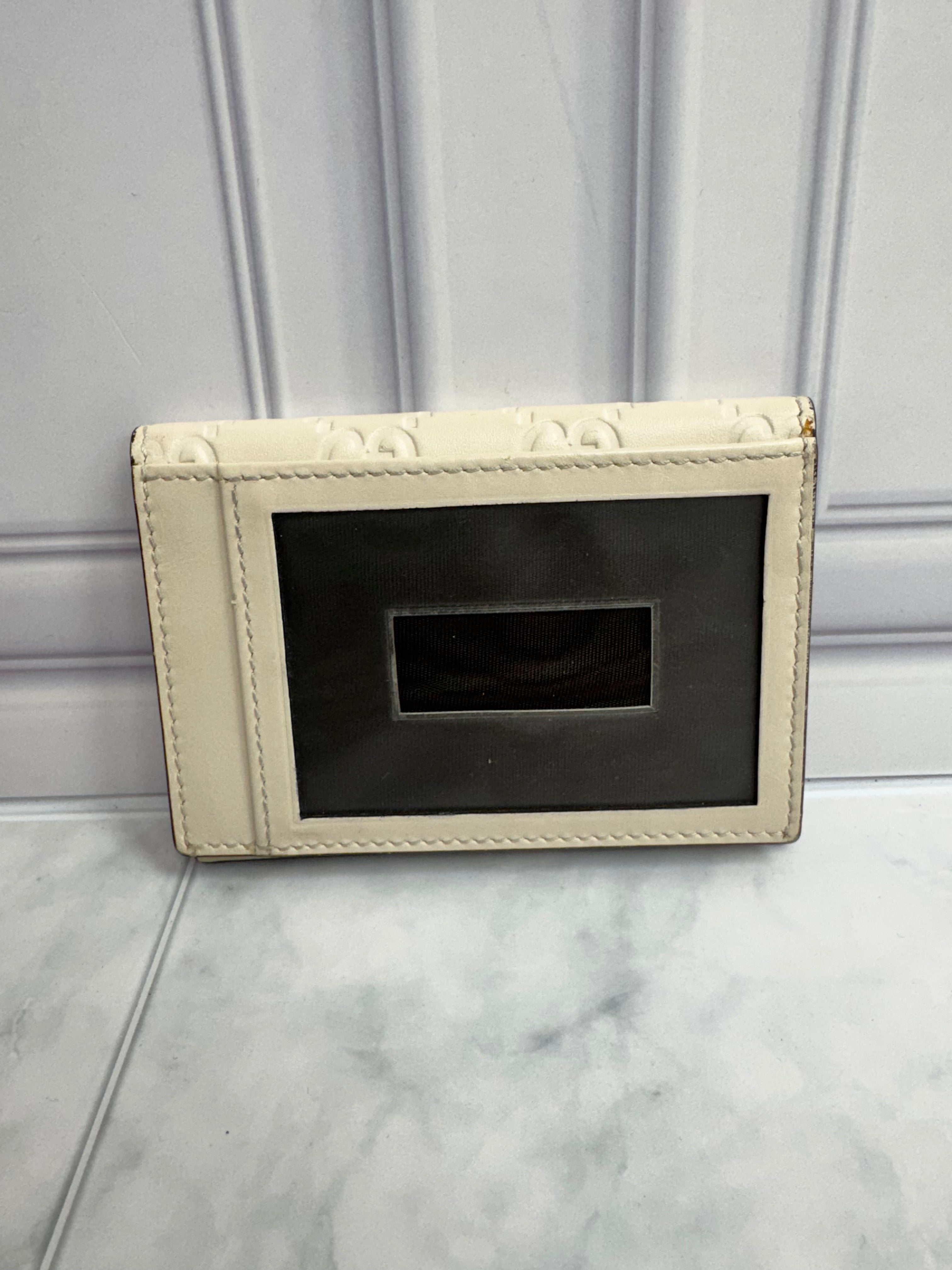 Gucci Beige Guccissima Embossed Leather Compact Wallet