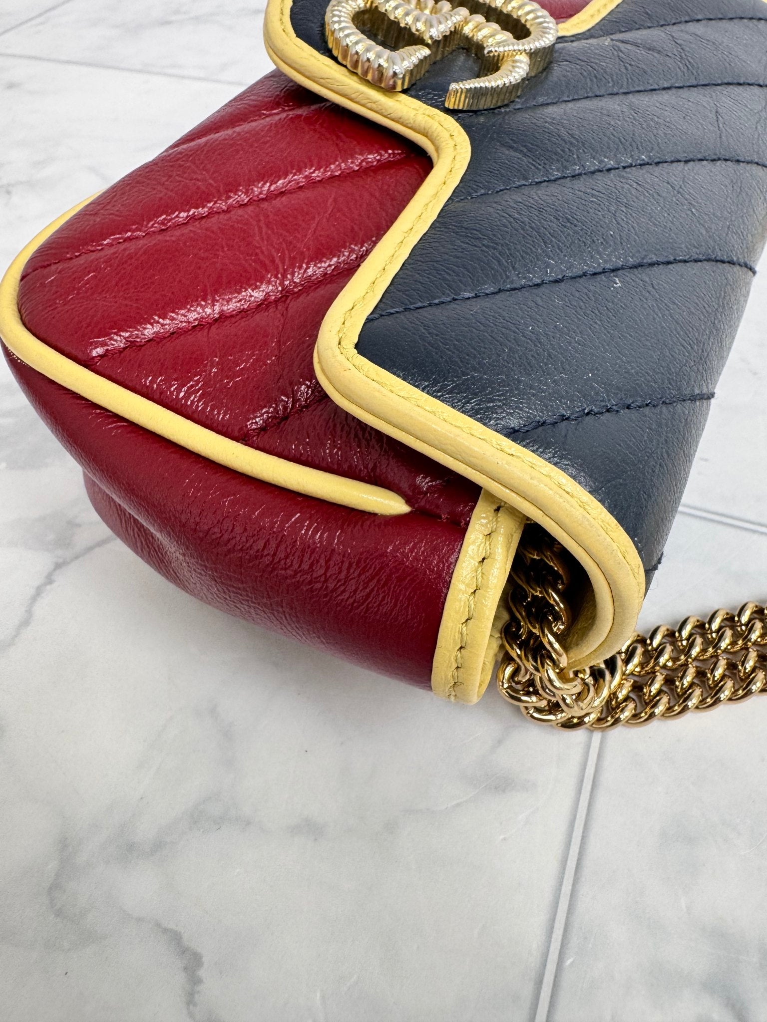 Gucci Red And Navy Quilted GG Marmont Torchon Super Mini Crossbody Bag
