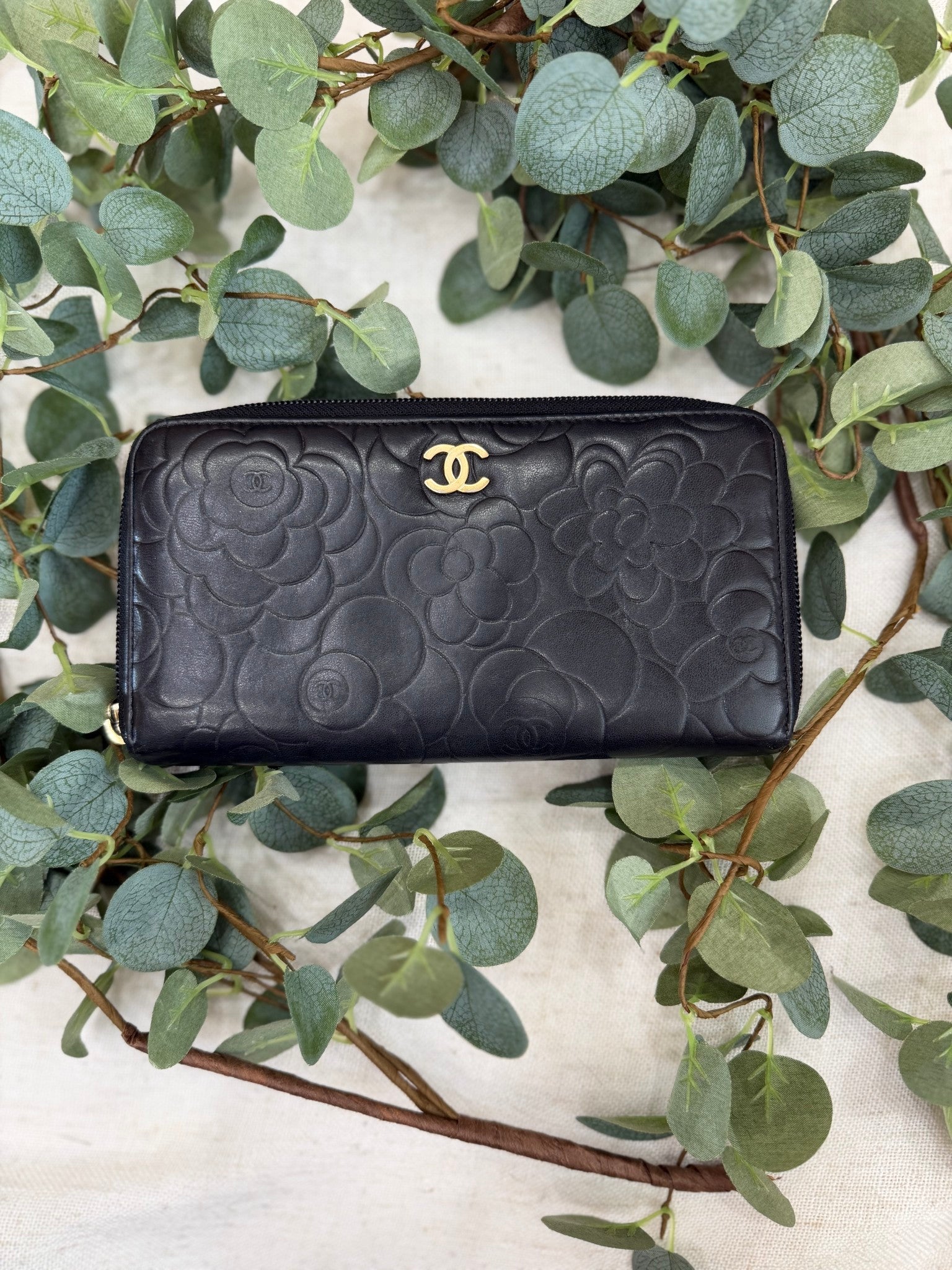 Chanel Black Lambskin Camellia Embossed Zippy Wallet