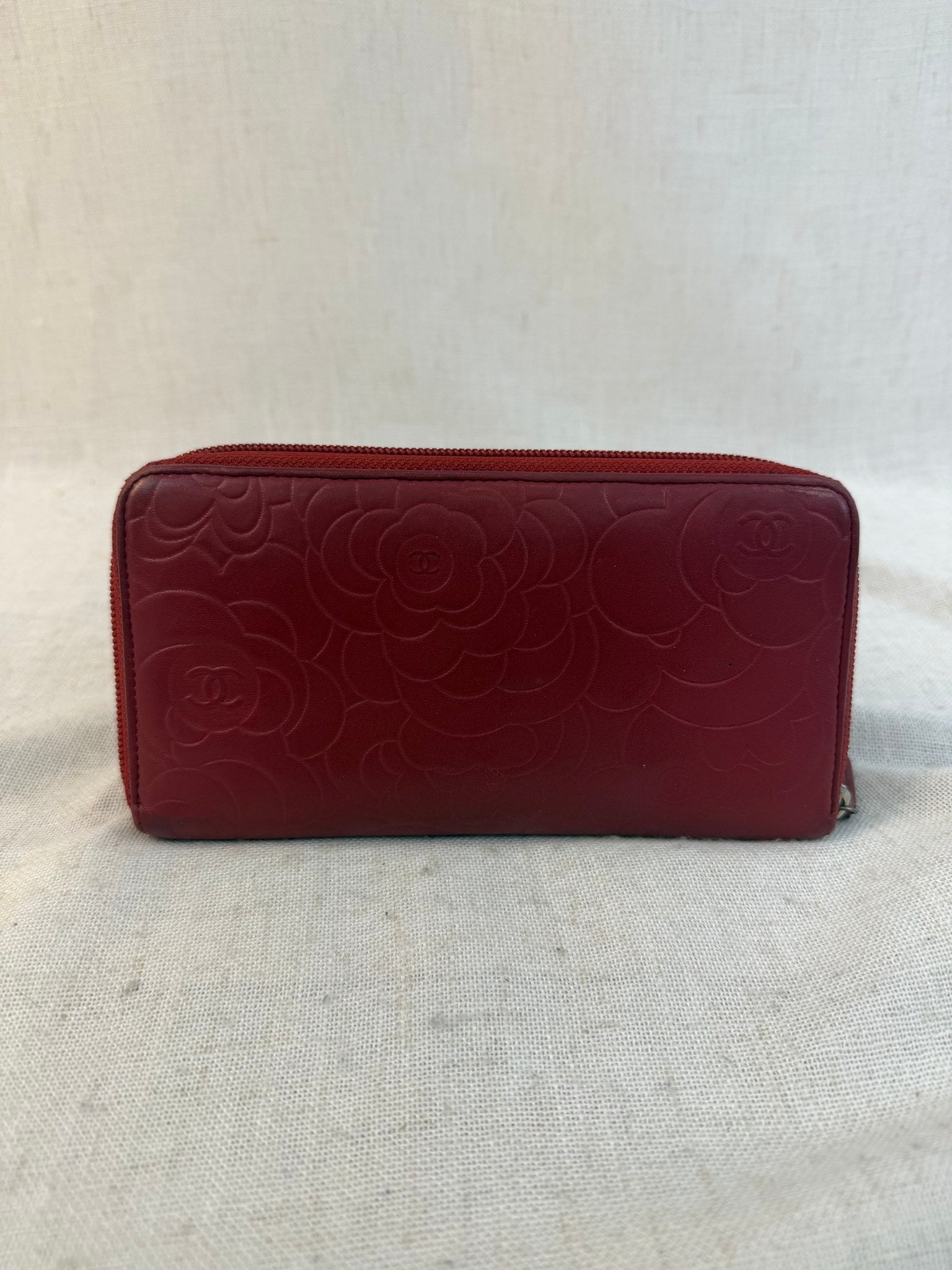 Chanel Red Lambskin Camellia Embossed Zippy Wallet