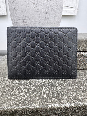 LIKE NEW - Gucci Black Microguccissima Embossed Bi Fold Wallet