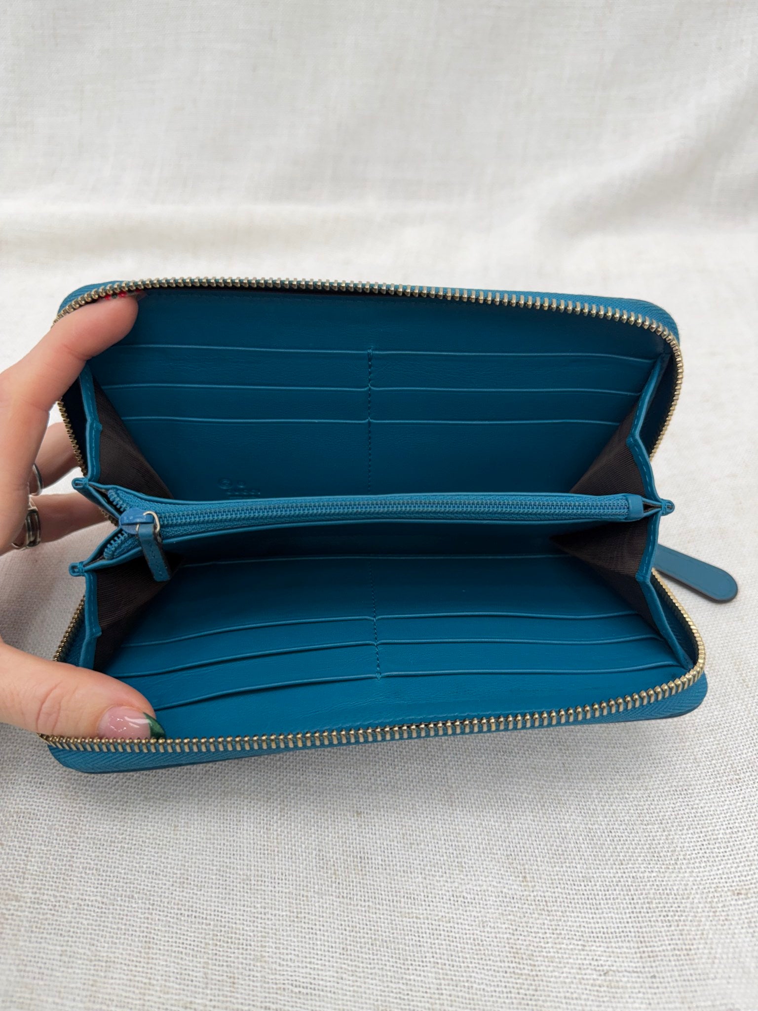 Gucci Teal Guccissima Leather Zippy Leather