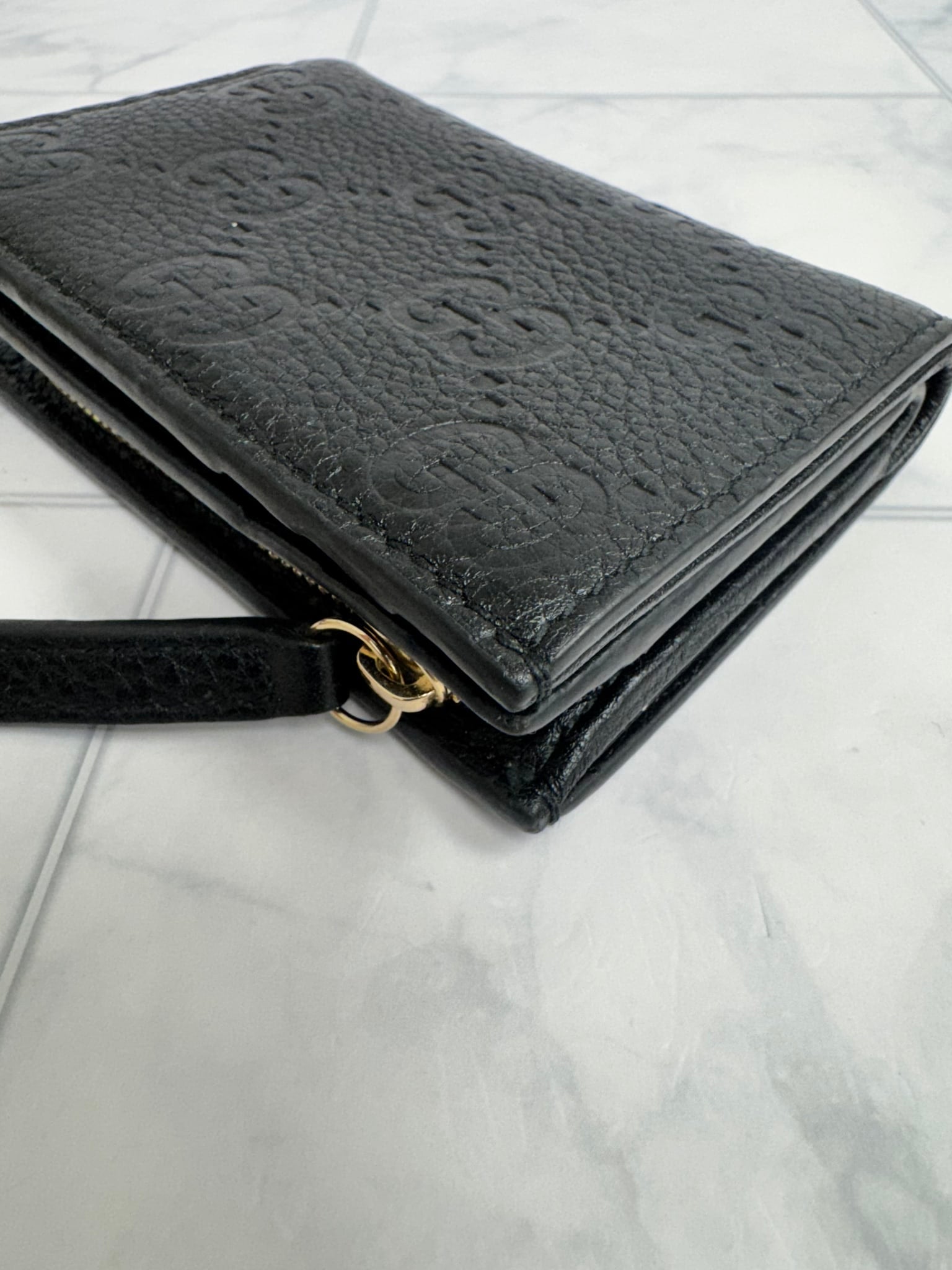 Gucci Black GG Embossed Leather Compact Wallet