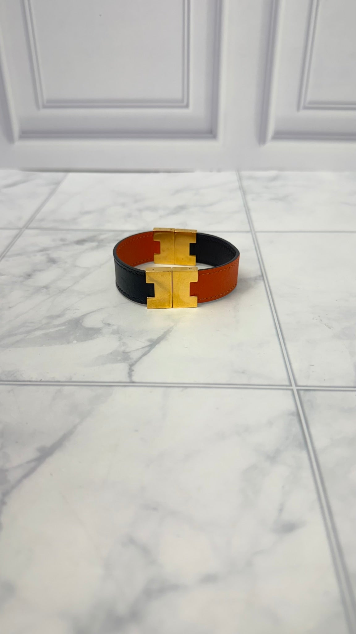 Hermes Black And Orange Leather Lurie Reversible Bracelet