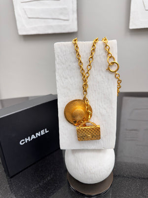 Chanel Gold Tone Sun Hat And Quilted Handbag Necklace