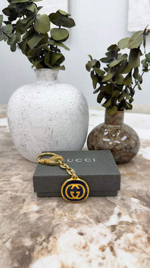 Gucci Gold Tone Enamel Interlocking G KeyChain