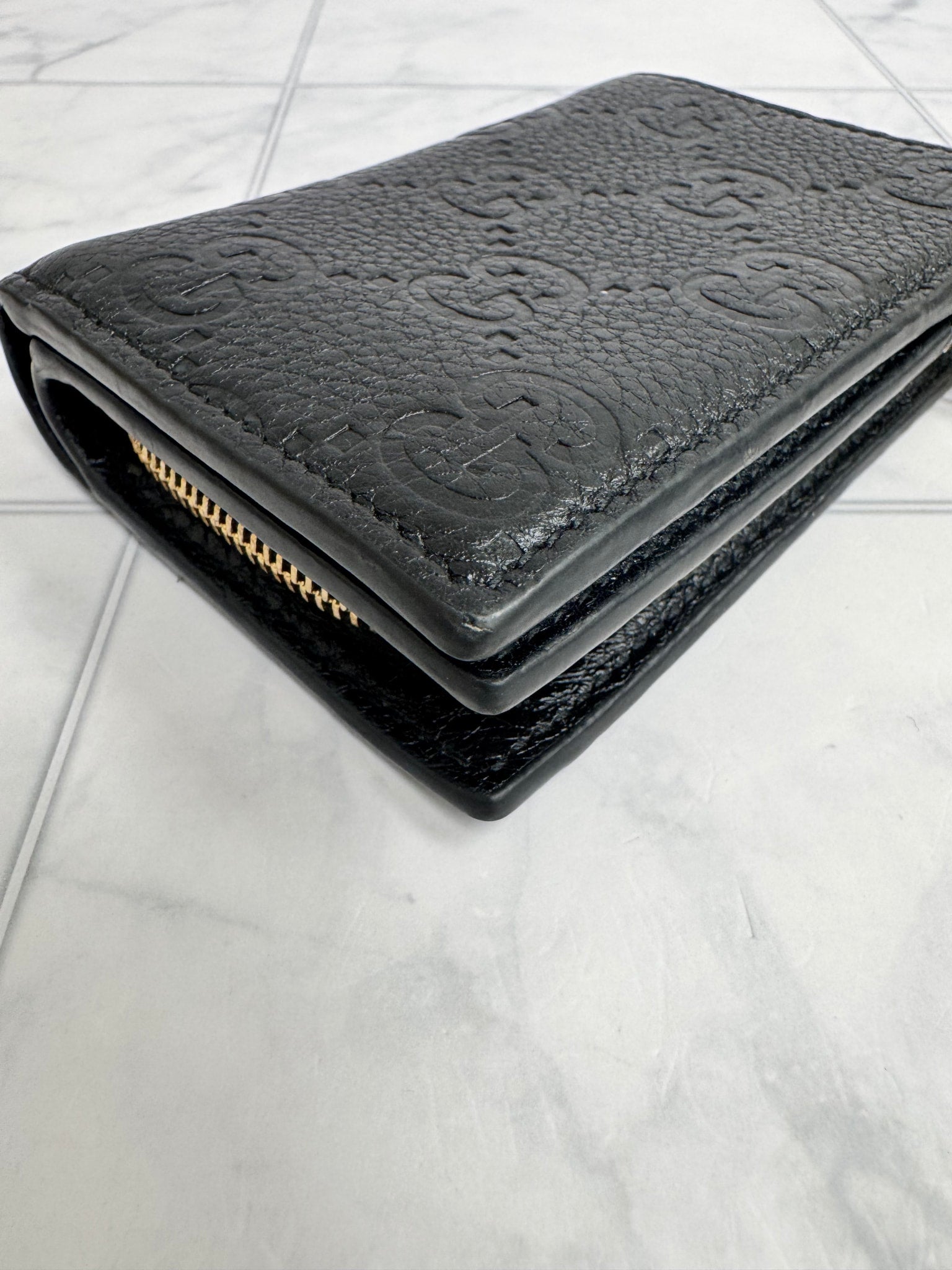Gucci Black GG Embossed Leather Compact Wallet
