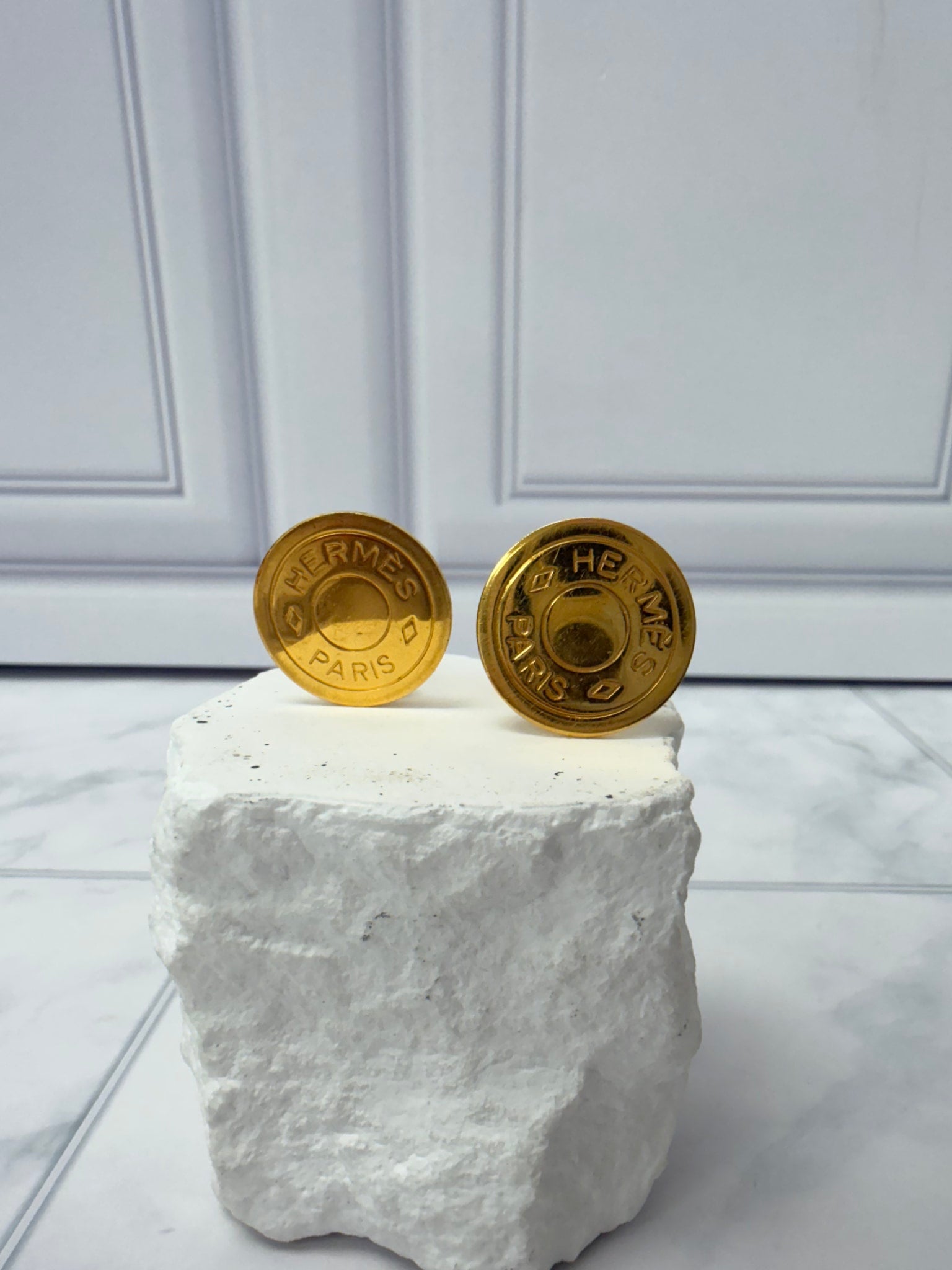 Hermes Gold Tone Coin Clip On Earrings
