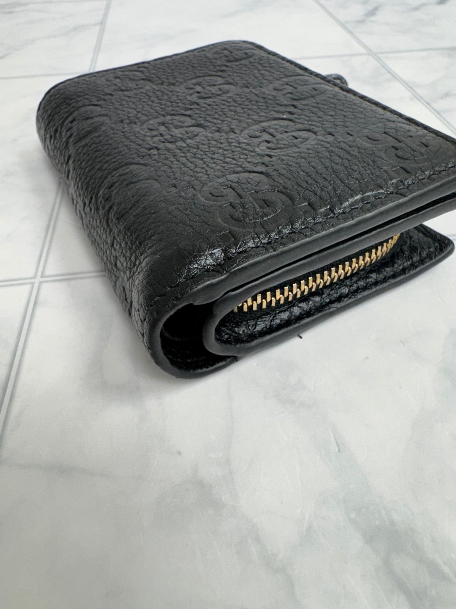 Gucci Black GG Embossed Leather Compact Wallet