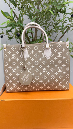 Louis Vuitton Green And Cream Monogram Empreinte Leather On The Go Handbag